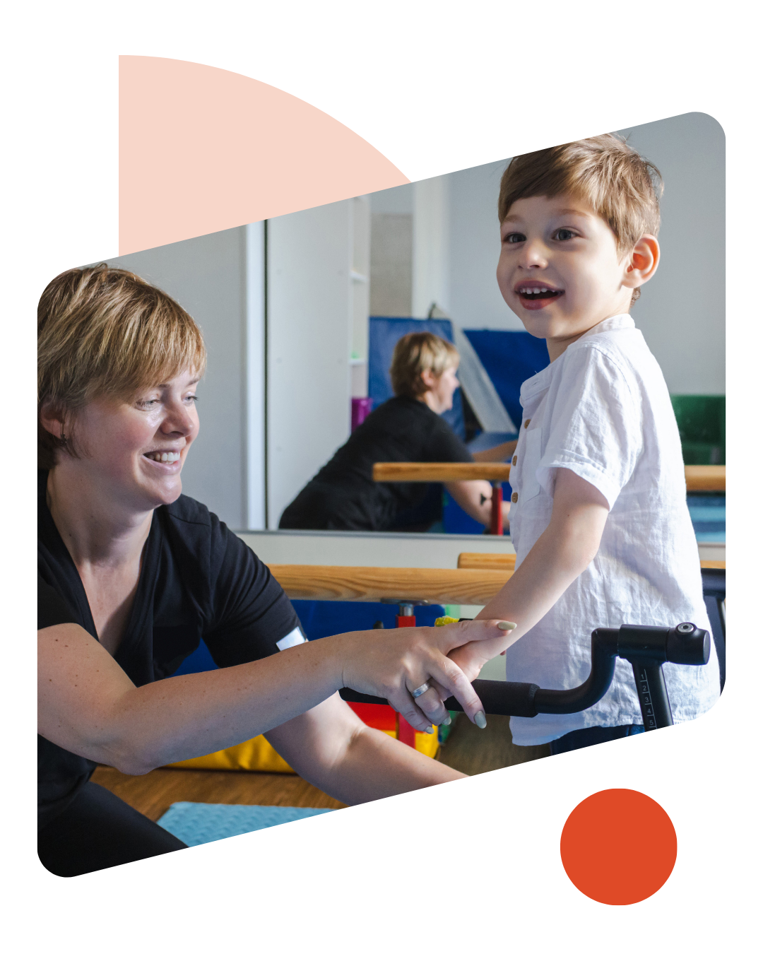 Bobath therapist assists a young boy with cerebral palsy as he practices using a supportive mobility device during a session.